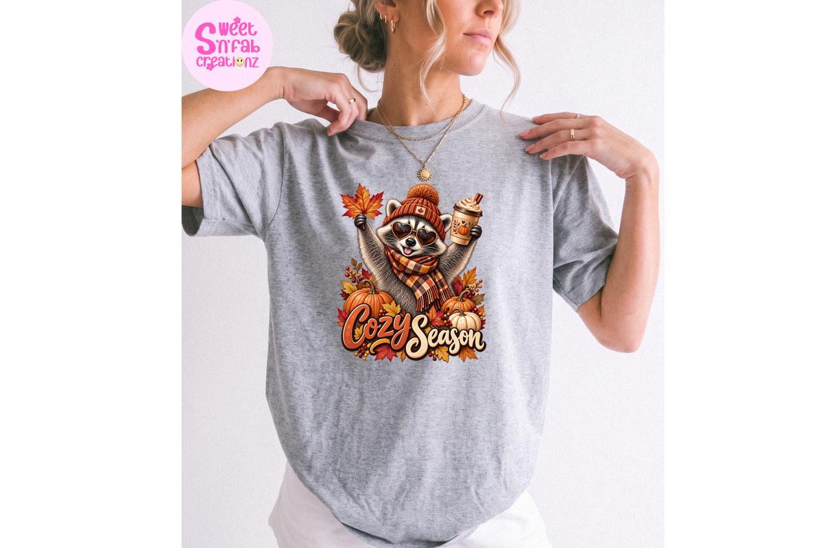 Cozy Season Raccoon T-Shirt | Cute Fall Pumpkin Spice Graphic Tee